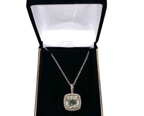 green amethyst in a halo of diamonds
