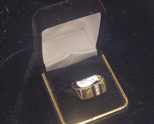 mans custom gold ring with onyx and diamonds