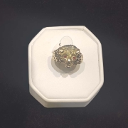 mans custom gold lion head ring with red eyes