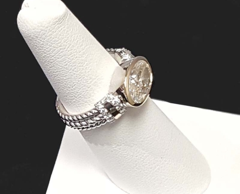 ladies custom diamond ring with a 2.80ct oval diamond and .20cts of accent diamonds