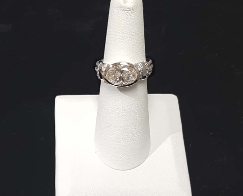 ladies custom diamond ring with a 2.80ct oval diamond and .20cts of accent diamonds