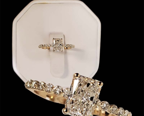 custom 1.01ct radiant cut diamond .24cts in diamonds down the sides - set in 14k yellow gold