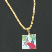 lasered image on gold pendant