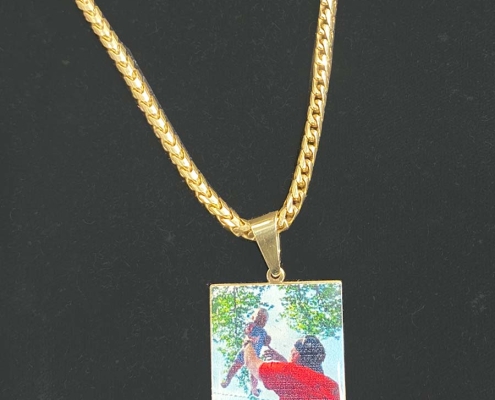 lasered image on gold pendant