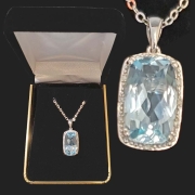 10k white gold with emerald cushion cut topaz surrounded by halo of diamonds