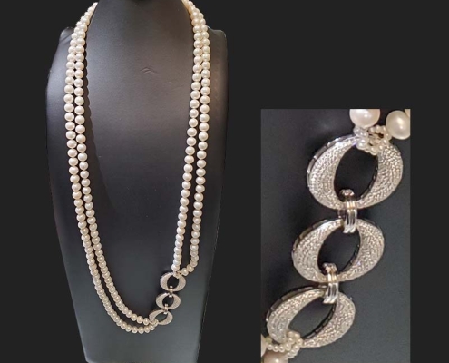 40" double strand freshwater pearl necklace with 3 reversible solid silver hoop connectors fully enhanced with top of the line cubics on one side and flat shiny silver with only a few crystals on the other