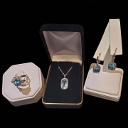 10k white gold with emerald cushion cut topaz surrounded by halo of diamonds with matching ring and earrings