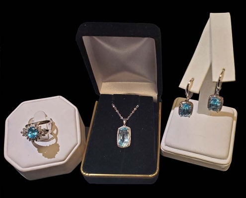 10k white gold with emerald cushion cut topaz surrounded by halo of diamonds with matching ring and earrings