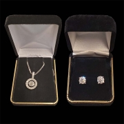 diamond pendant on white gold chain with matching diamond stud earrings